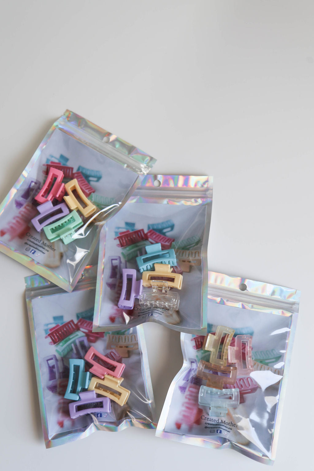 Compact micro claw clips in assorted pastel shades, perfect for any outfit or mood.