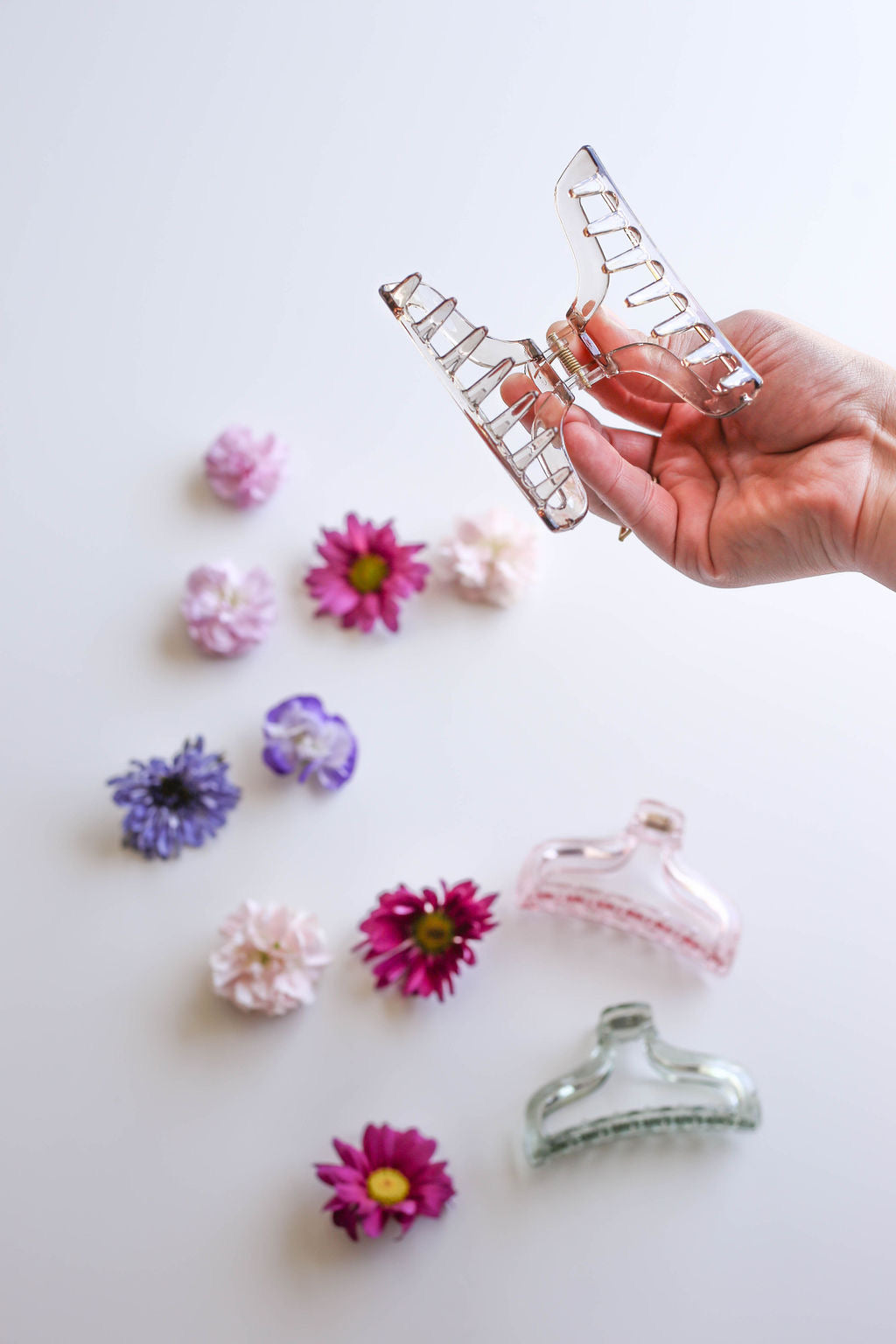 Colorful medium claw clips, adding a playful touch to any hairstyle.