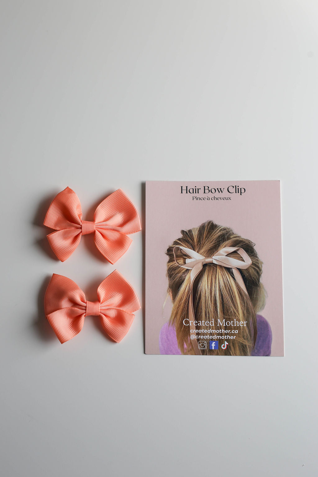 Premium mini ribbon bow clip designed to elevate ponytails, braids, or loose hairstyles.