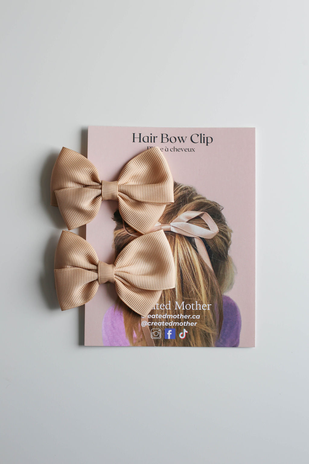 Polished beige ribbon bow hair clip for everyday wear or formal events.