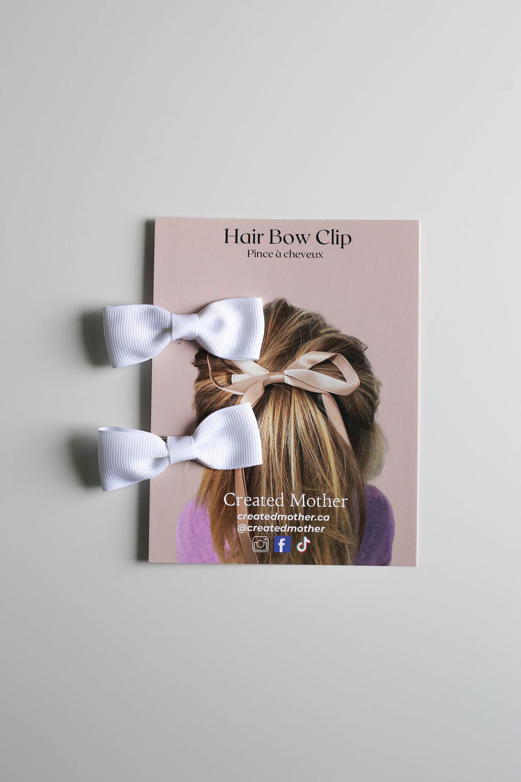 Handcrafted matching bow clips in a classic white, perfect for all ages