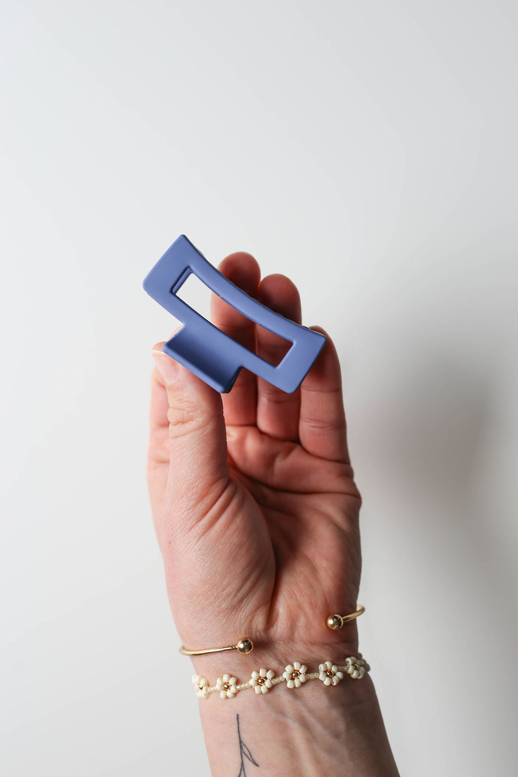 Bright dark blue claw clip in a sleek and sturdy design for everyday wear.