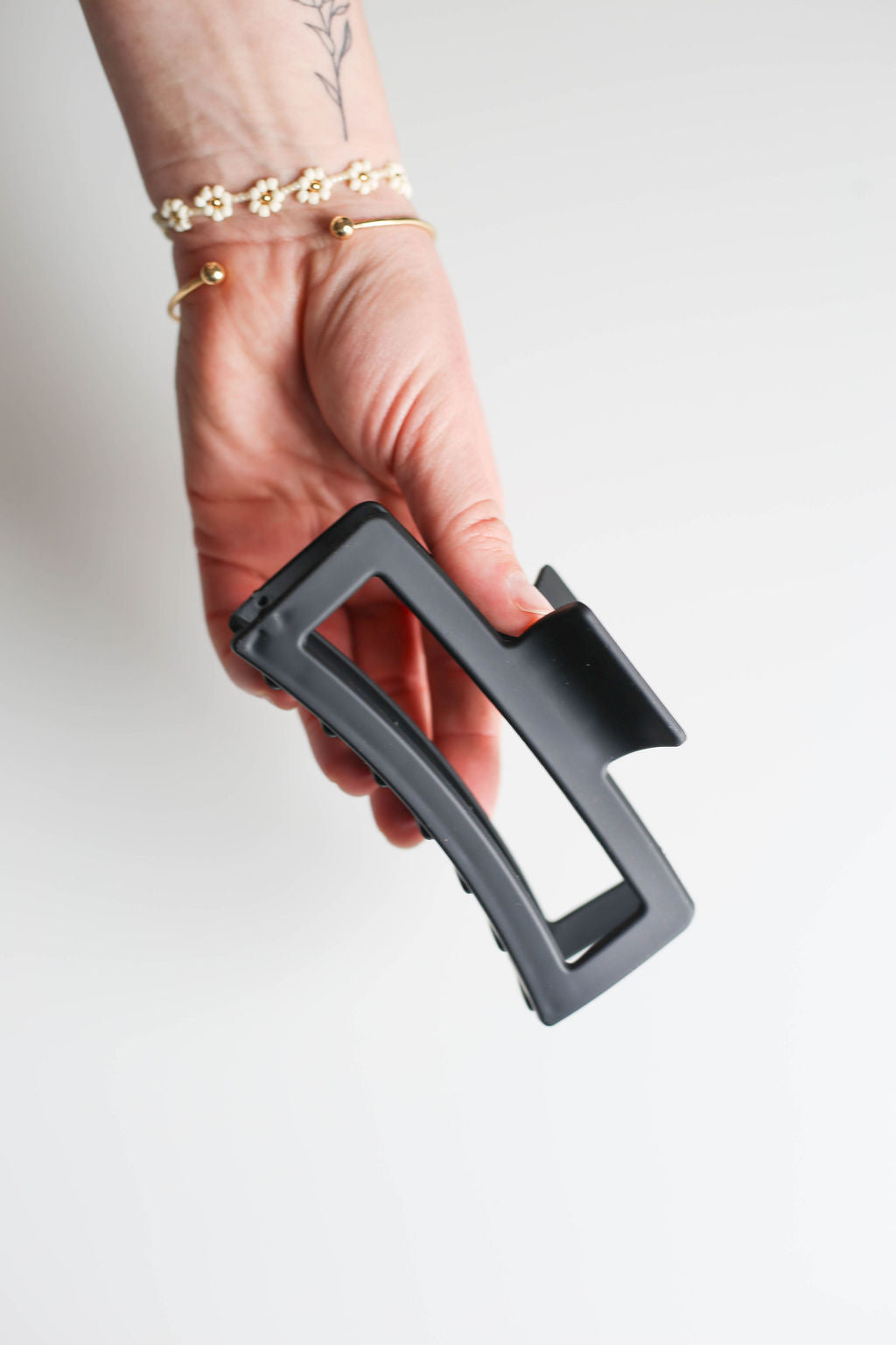 5” hair claw clip crafted to minimize hair damage and maintain smooth texture.