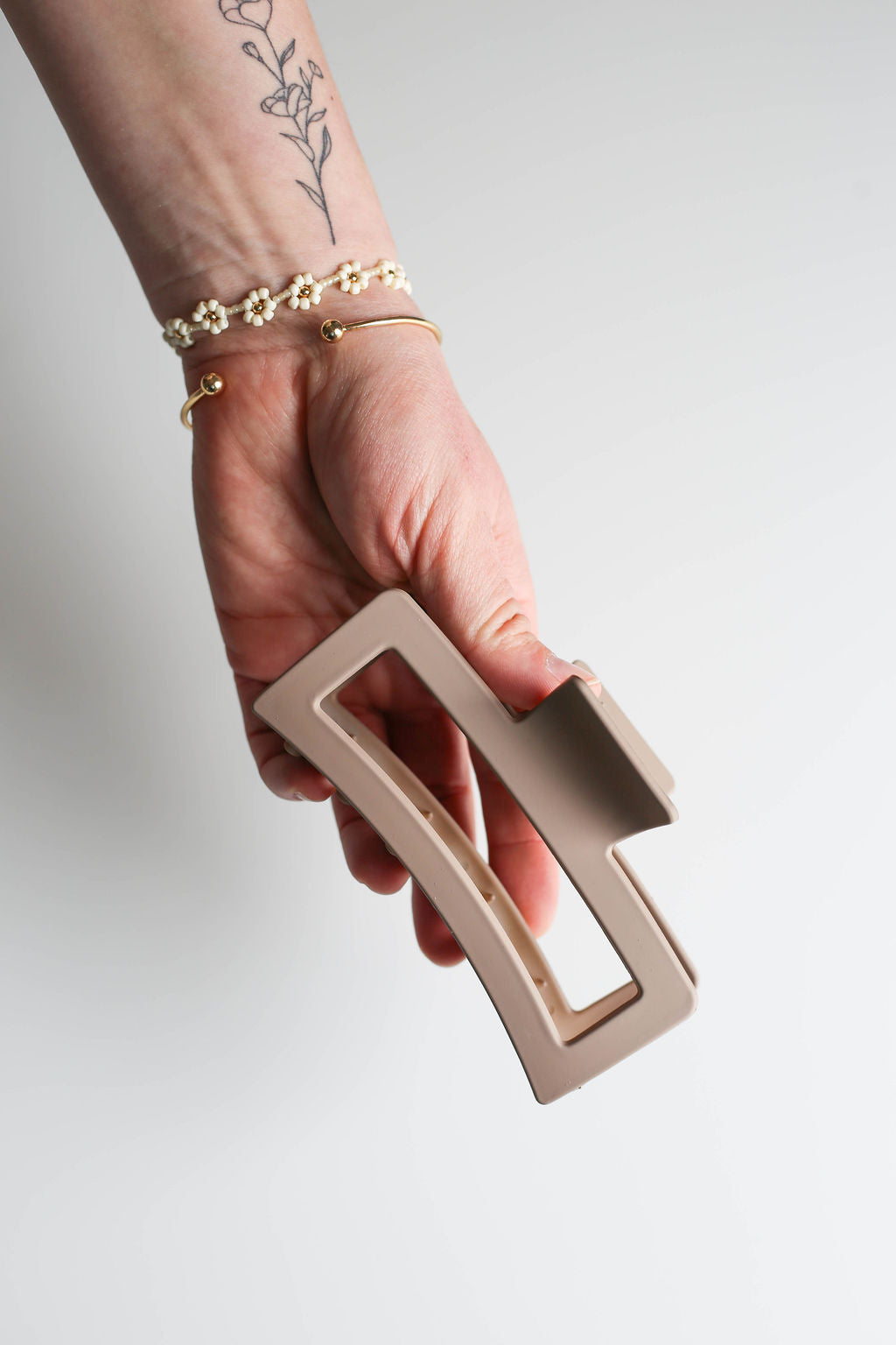 Durable, extra-large claw clip for secure hold during workouts or busy routines.