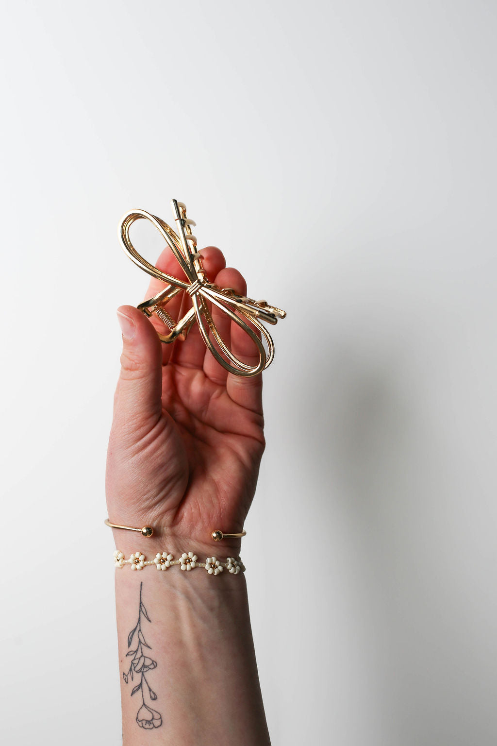 Durable and stylish bow hair claw for women.