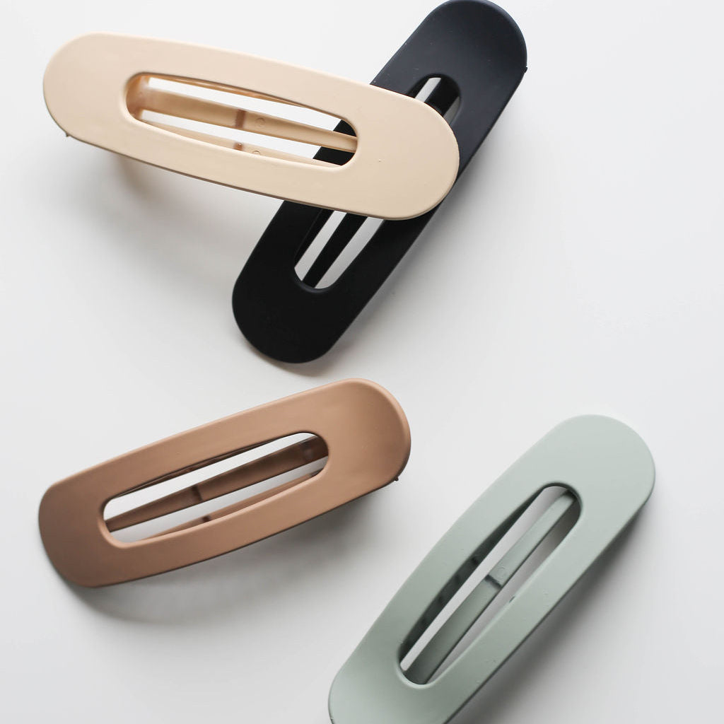 Low-profile neutral claw clip ideal for driving, lounging, or yoga