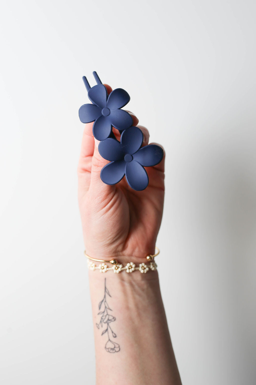 Navy blue oversized flat hair claw clip with floral design for yoga or driving
