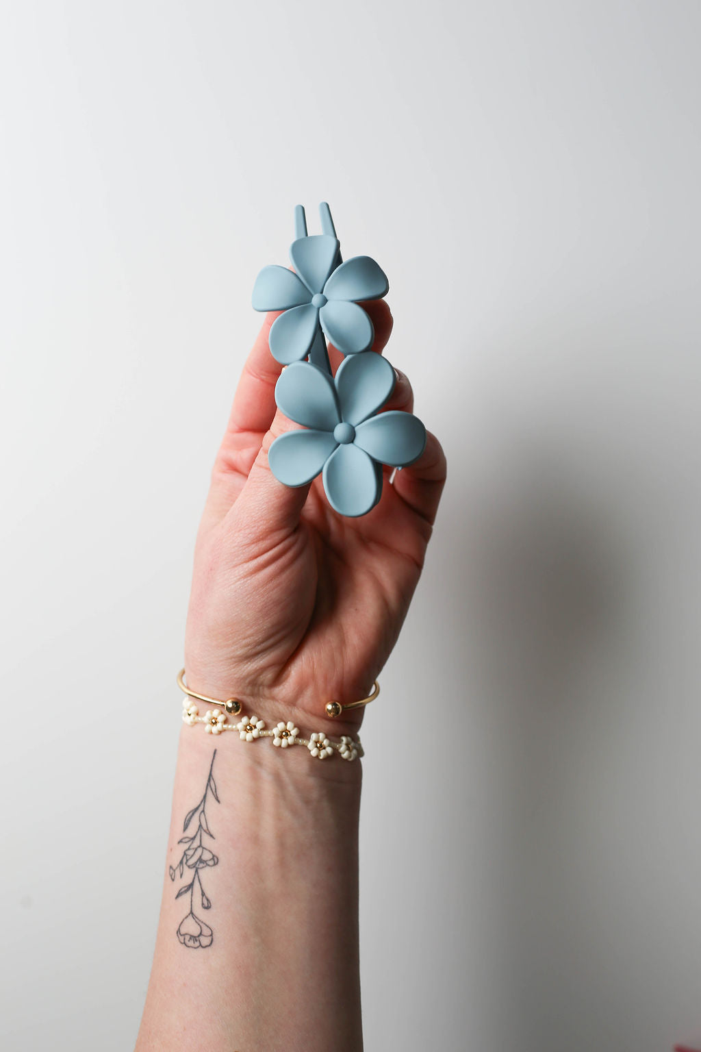Light blue lay flat flower claw clip for minimal hair tension and cute style