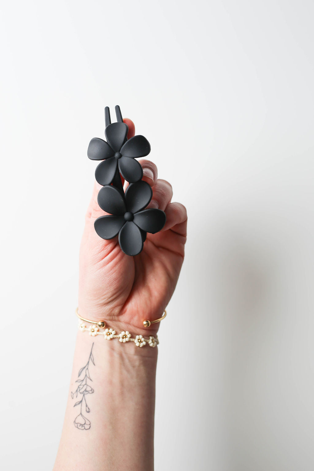 Matte black lay flat flower hair clip ideal for relaxed updos and half-up styles