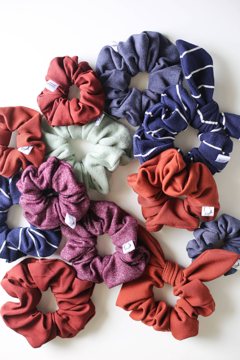Assorted colorful scrunchies on a white background