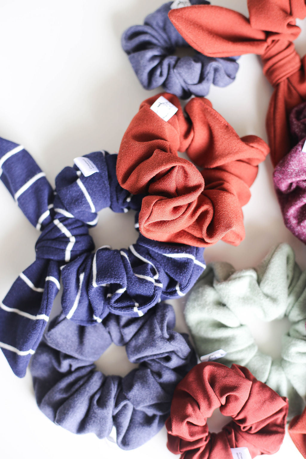 Collection of colorful scrunchies on a white background