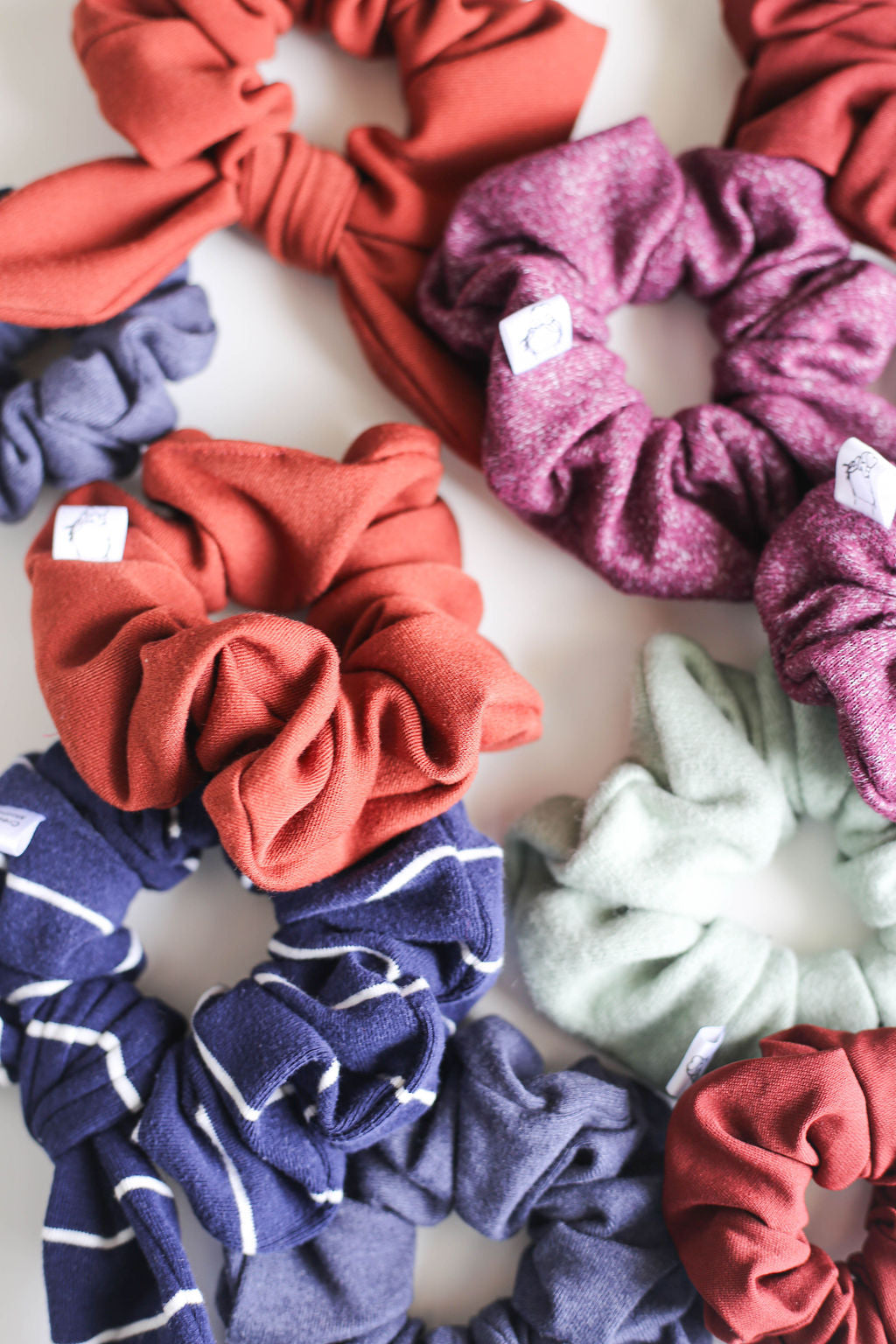 Collection of colorful scrunchies on a light background
