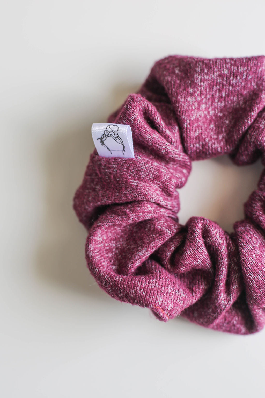 Purple jersey knit scrunchie against white background