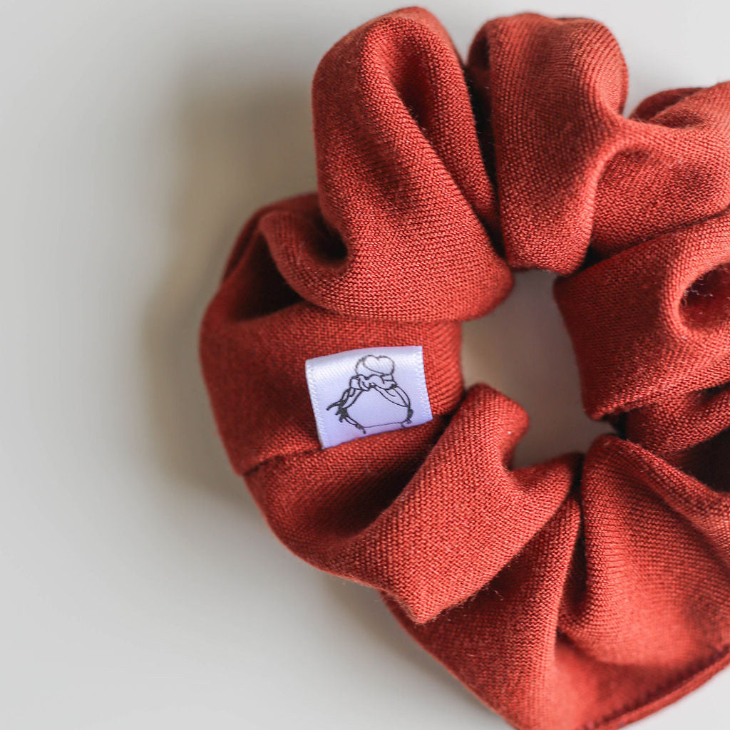 Fall-inspired hair scrunchie in earthy orange