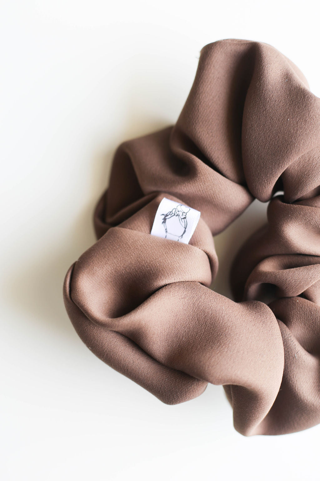 Deep brown scrunchie made from recycled materials by Created Mother