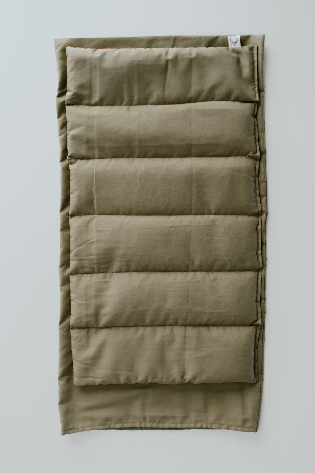 Green extra large hot and cold therapy pack, a calming solution for muscle aches and full-body relaxation.
