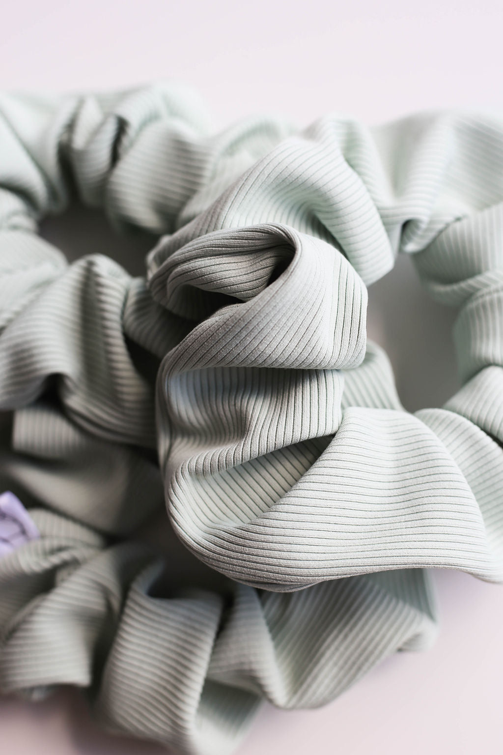 Water-resistant light sage scrunchie for pool and gym use