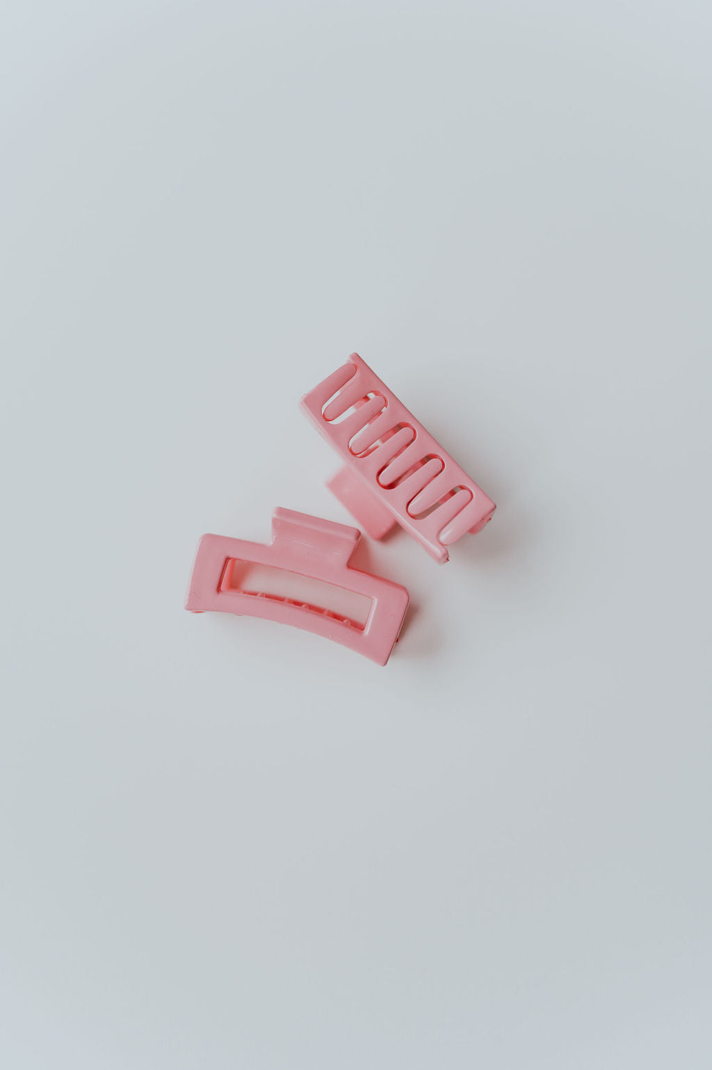 Group of mini hair clips in soft pastel tones, designed for easy hair styling.