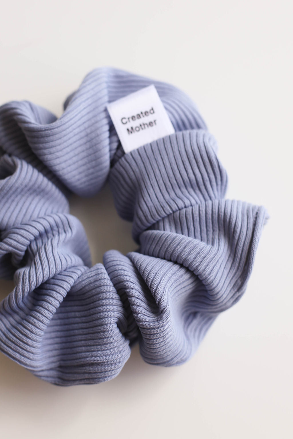Durable ribbed scrunchie designed to resist water and hold its color.
