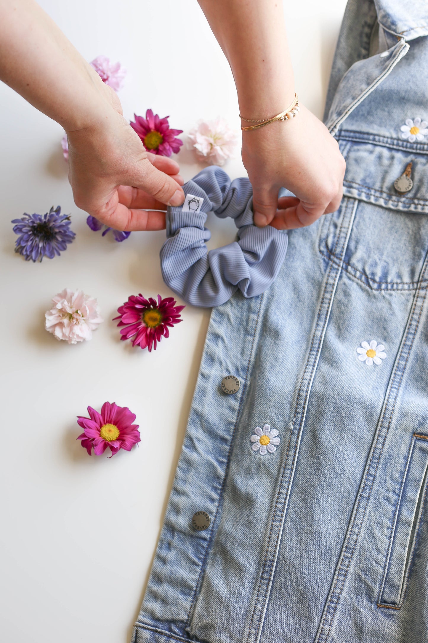 Durable SWIM scrunchie with all-day-hold elastic for secure comfort.