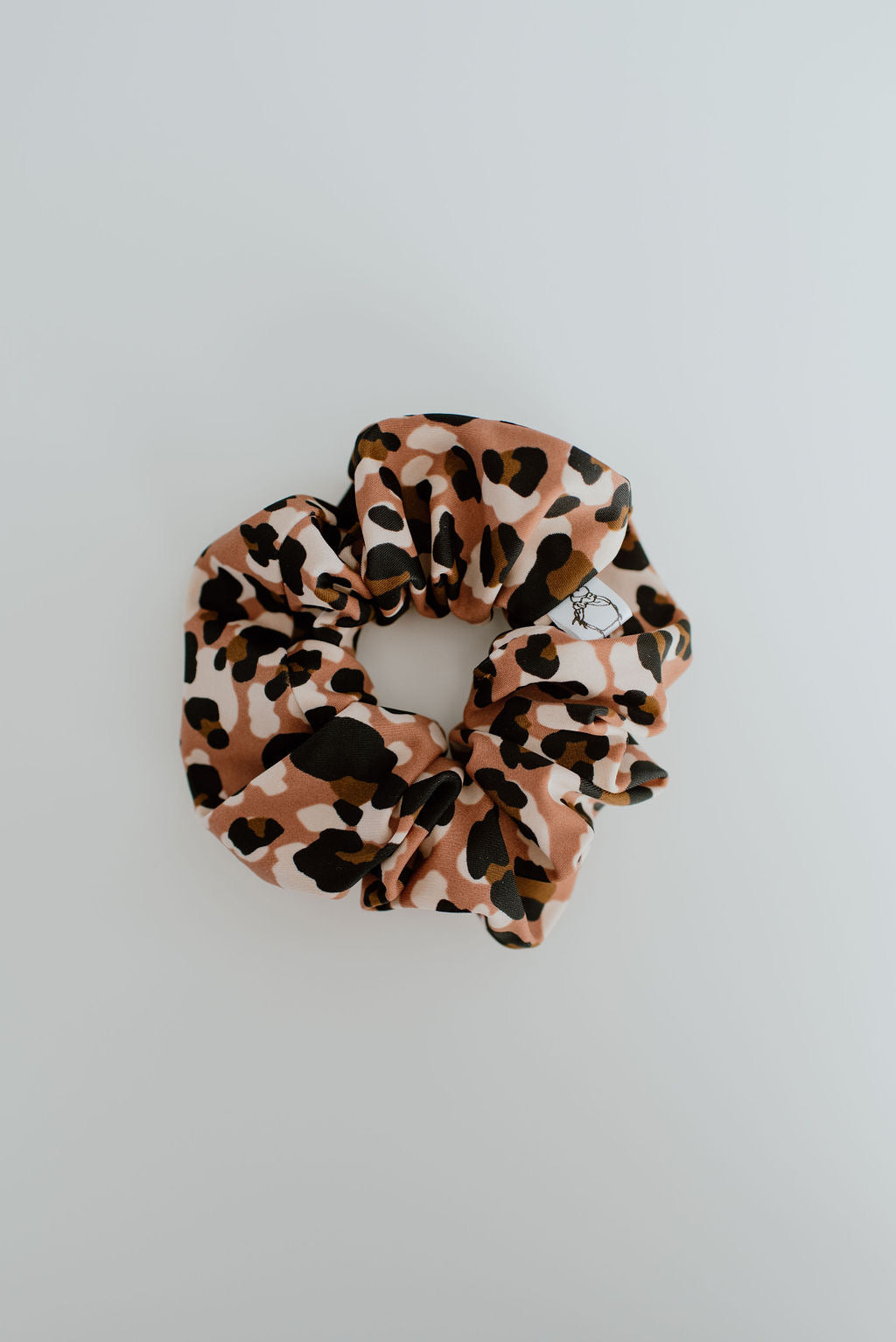 Leopard print swim scrunchie on a light gray background by Created Mother