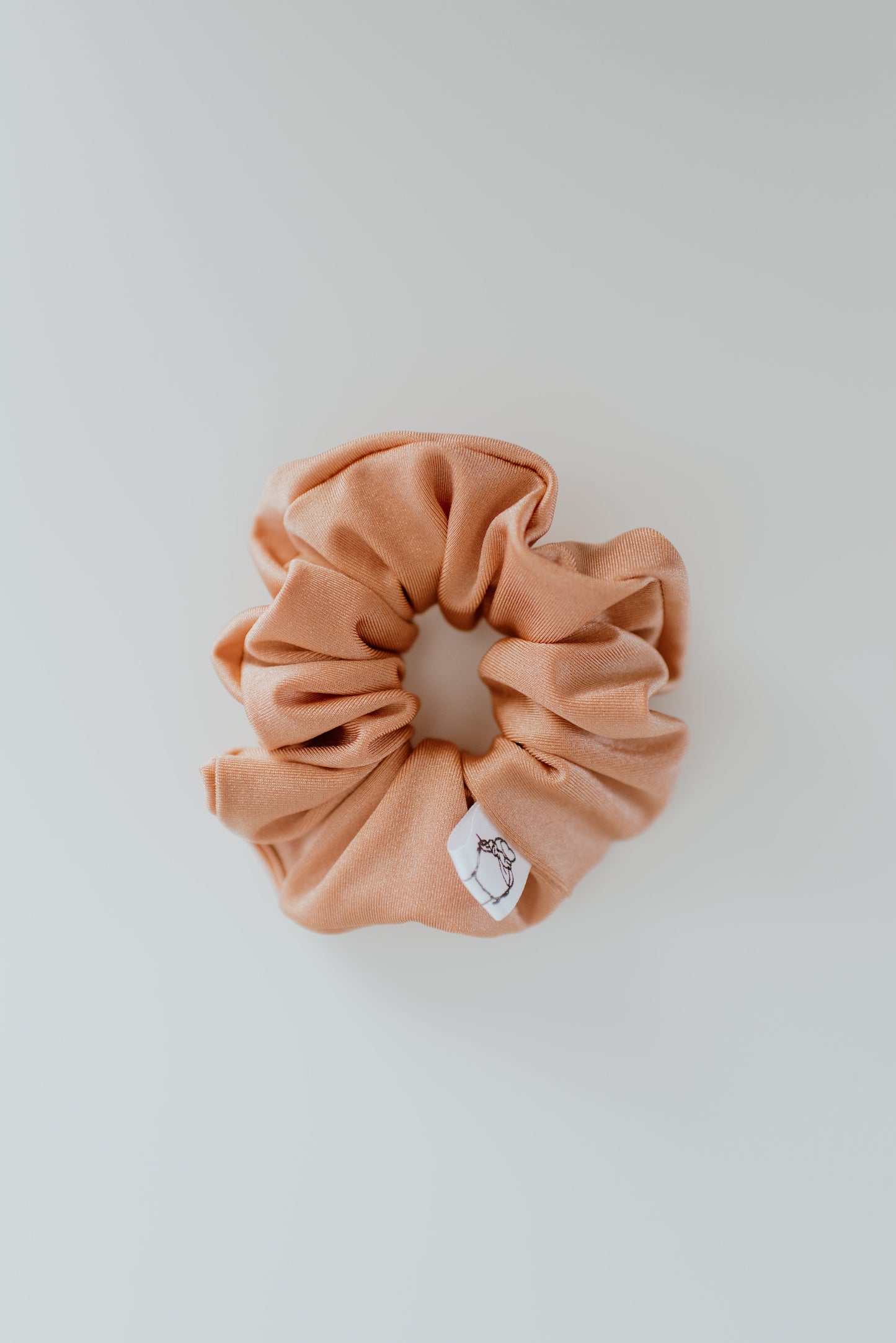 Durable peach swim scrunchie for active outdoor use