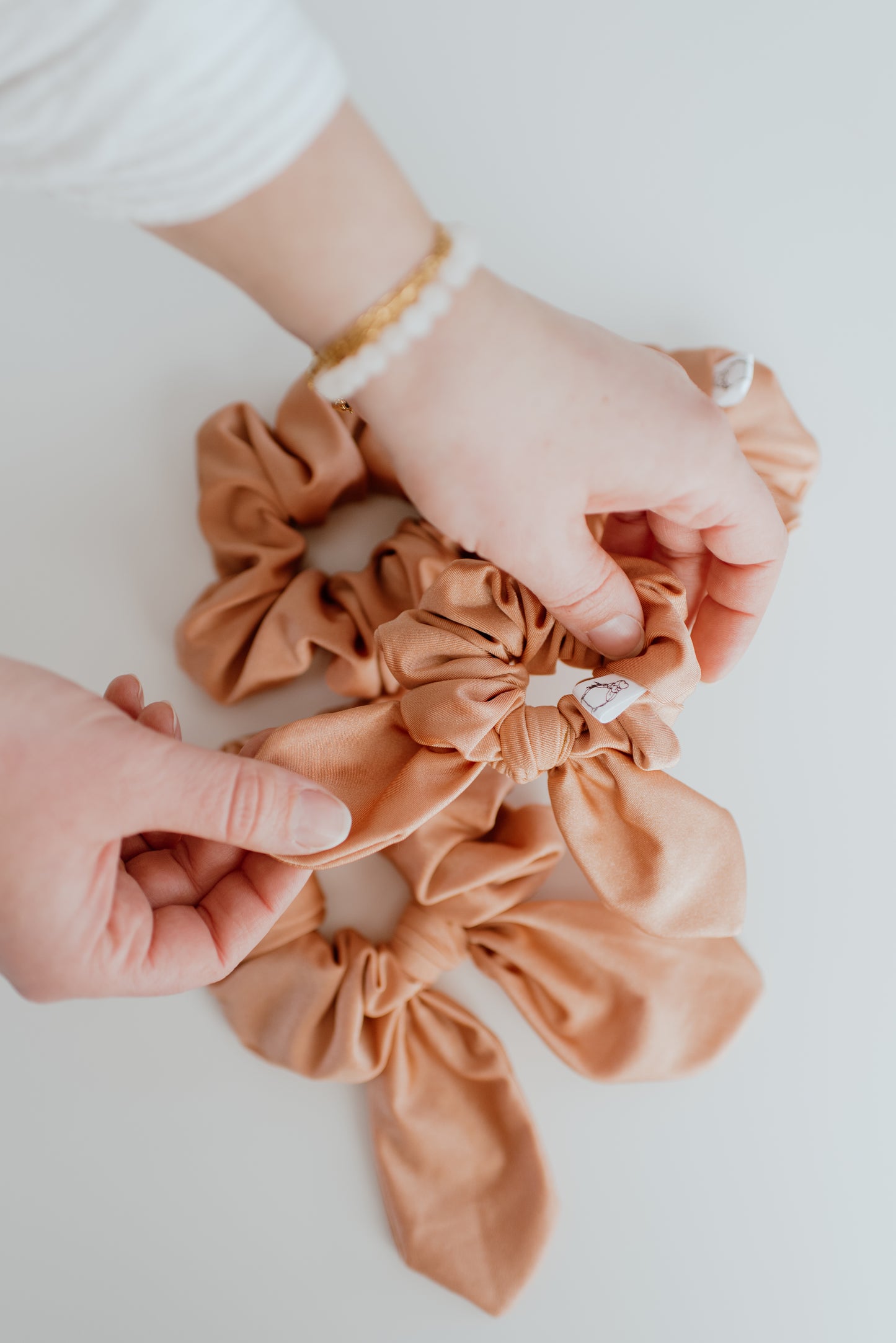 Peach swim scrunchie made of spandex and nylon blend