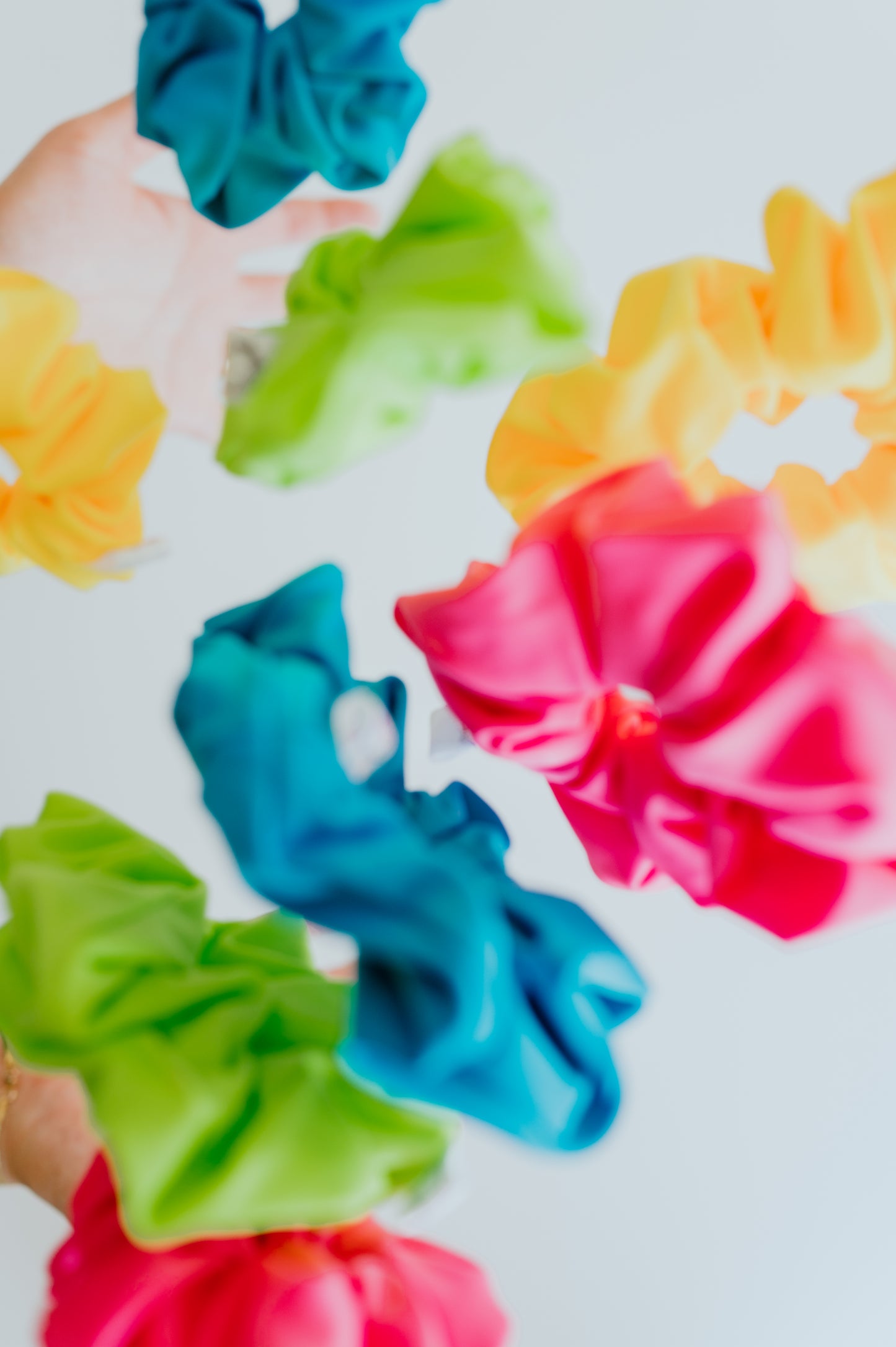 Bright neon swim scrunchies drying fast after water