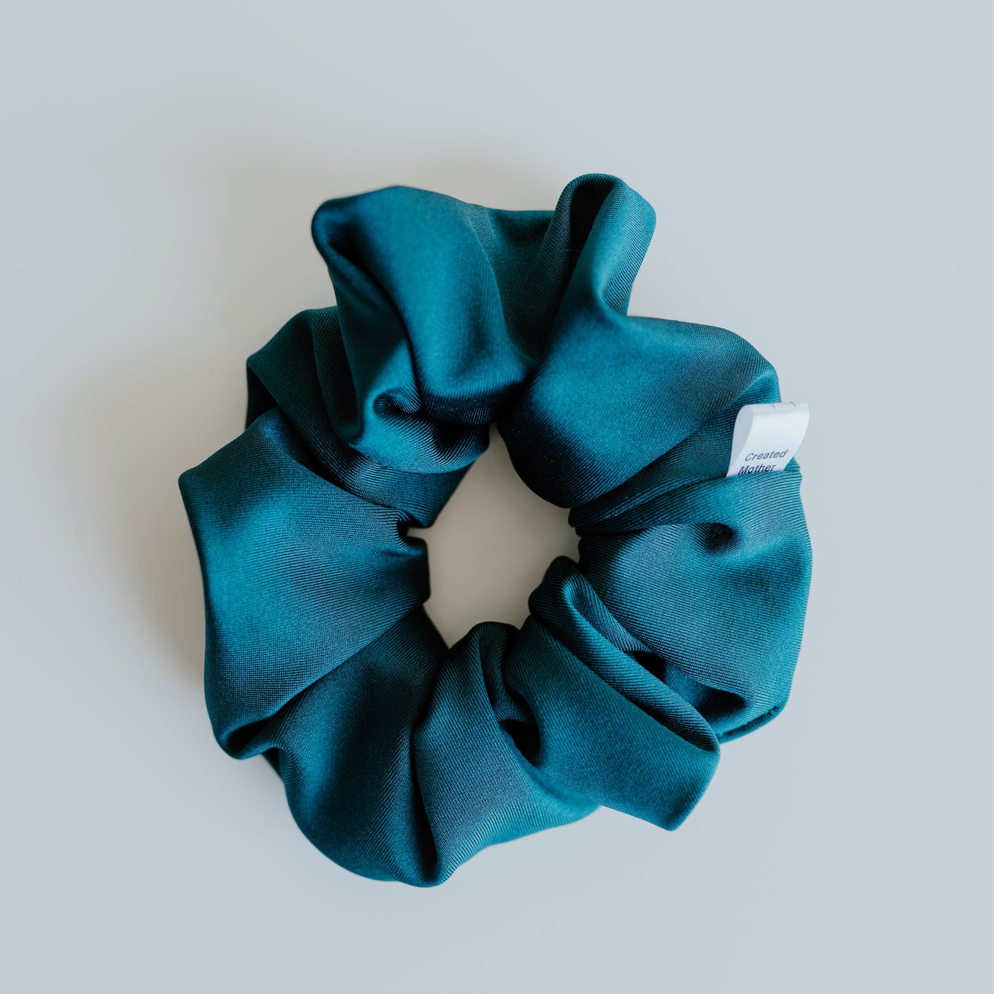 Teal swim scrunchie made from quick-dry fabric