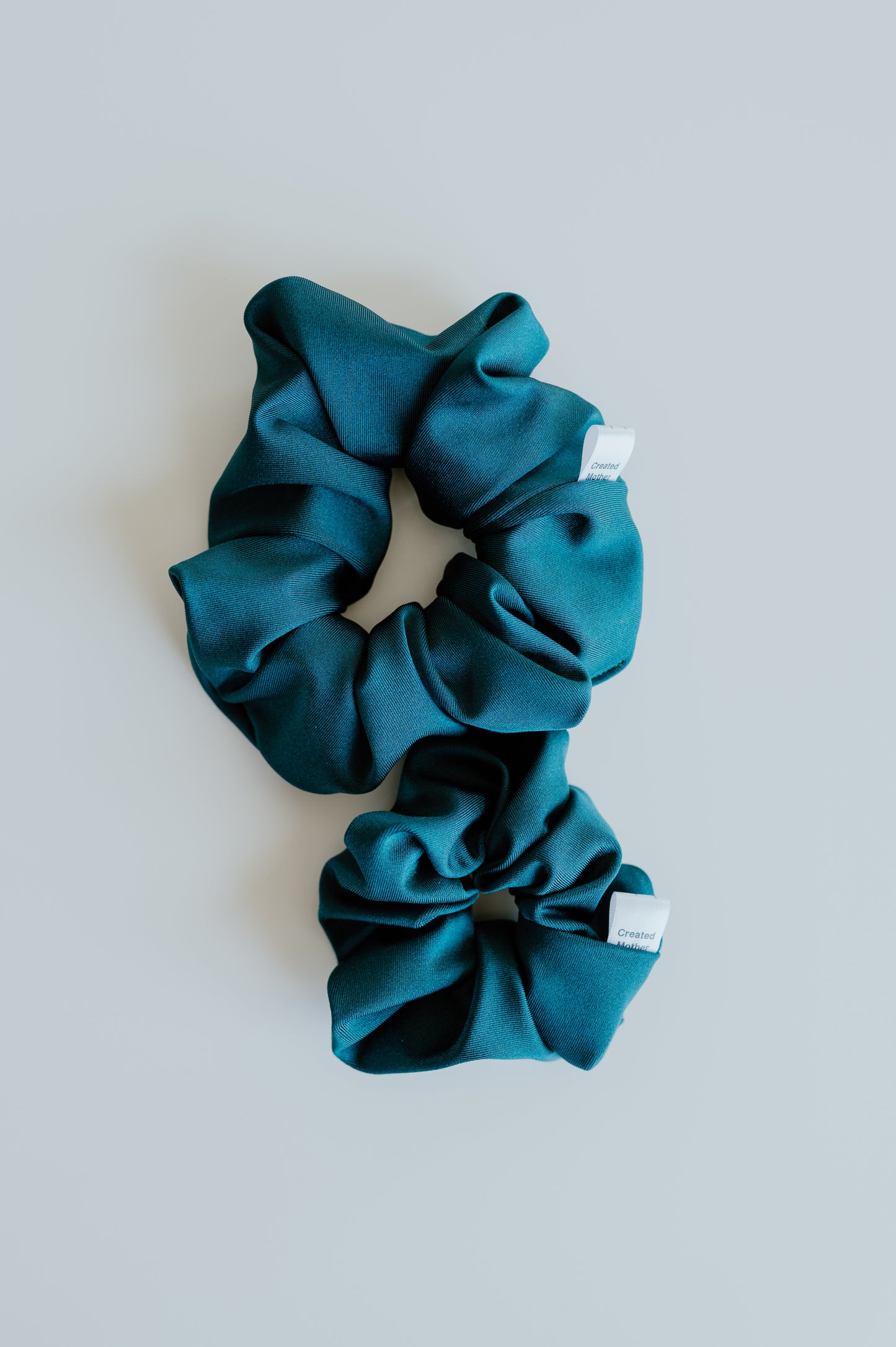 Water-resistant teal scrunchie for pool and gym use