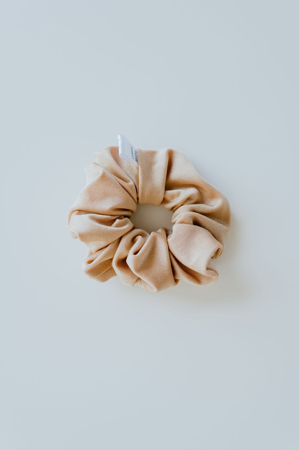 Durable gold scrunchie for active outdoor lifestyles