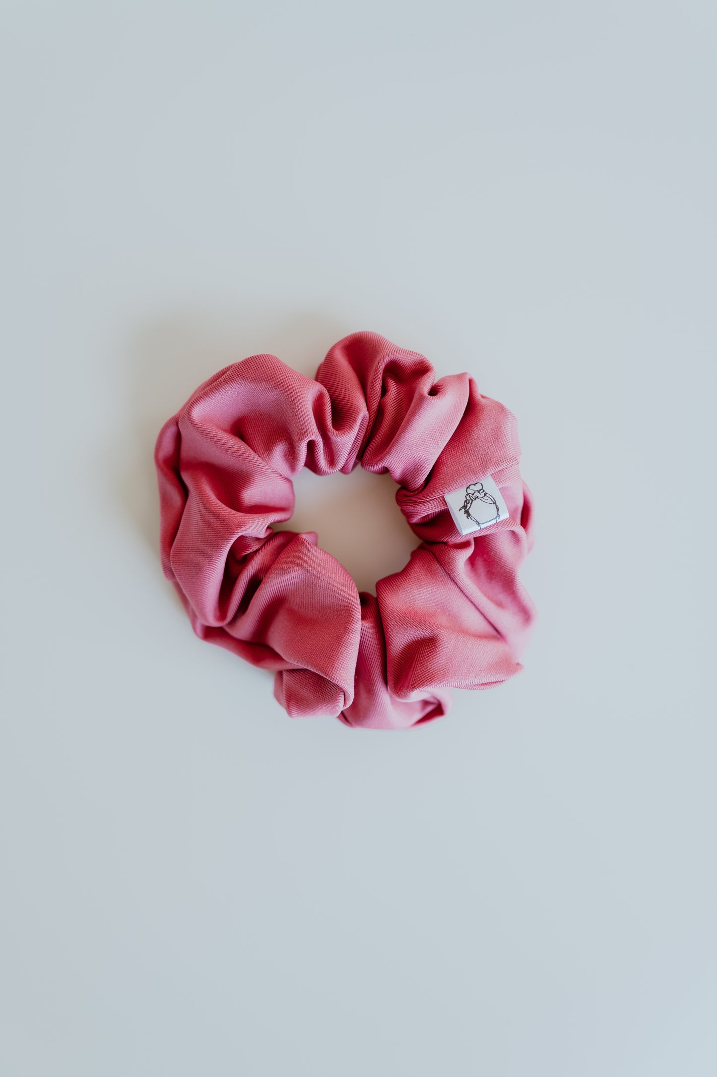 Bright coral scrunchie for beach and hiking days