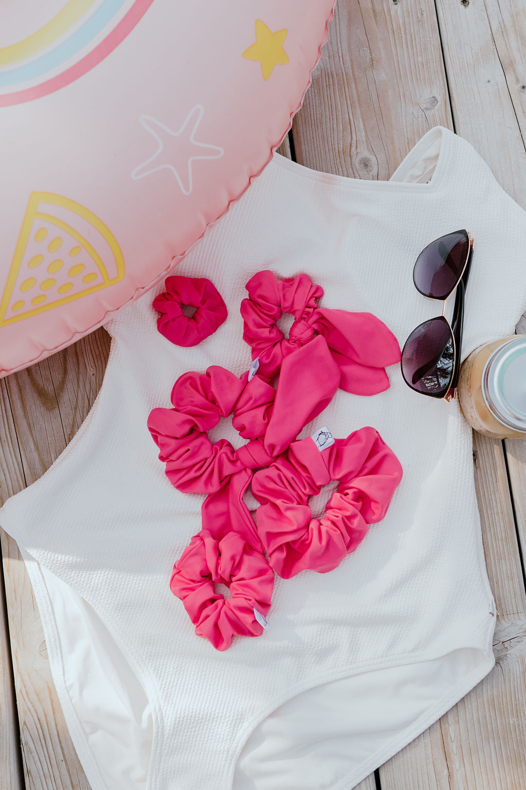 Fun pink swim scrunchie holding hair securely