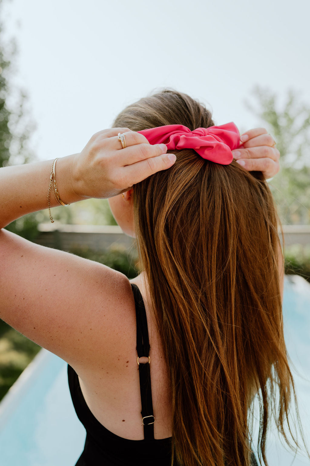 Bright pink scrunchie drying fast after water exposure