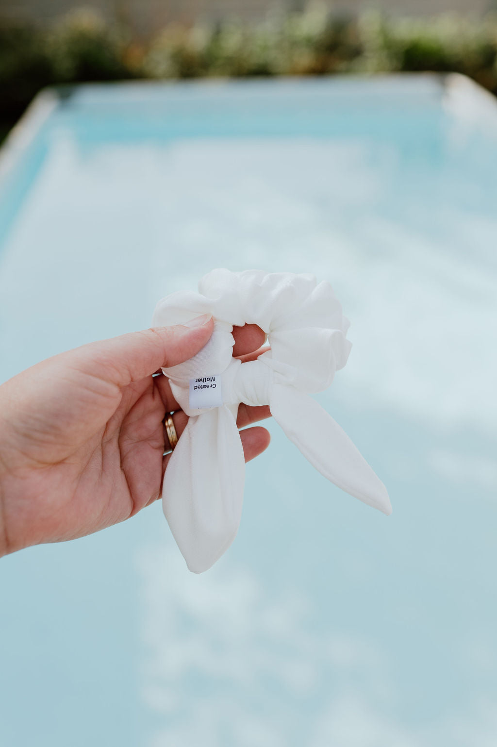 Water-resistant white scrunchie for pool and beach use
