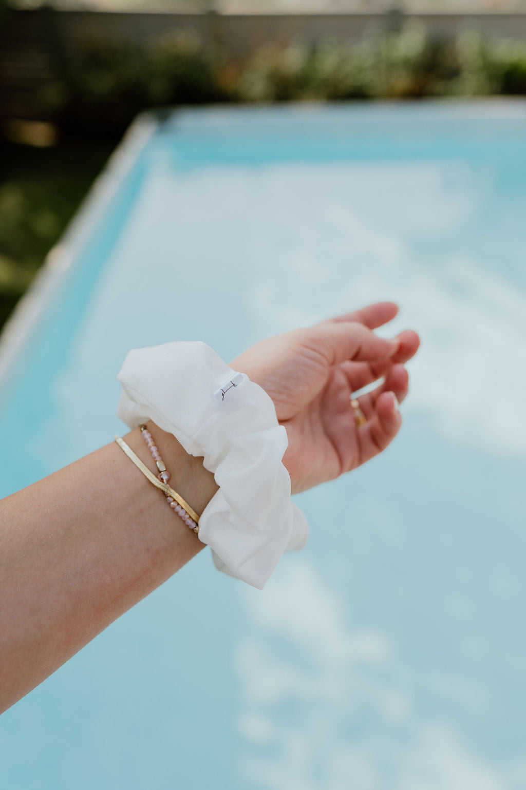 White scrunchie made of spandex and nylon blend
