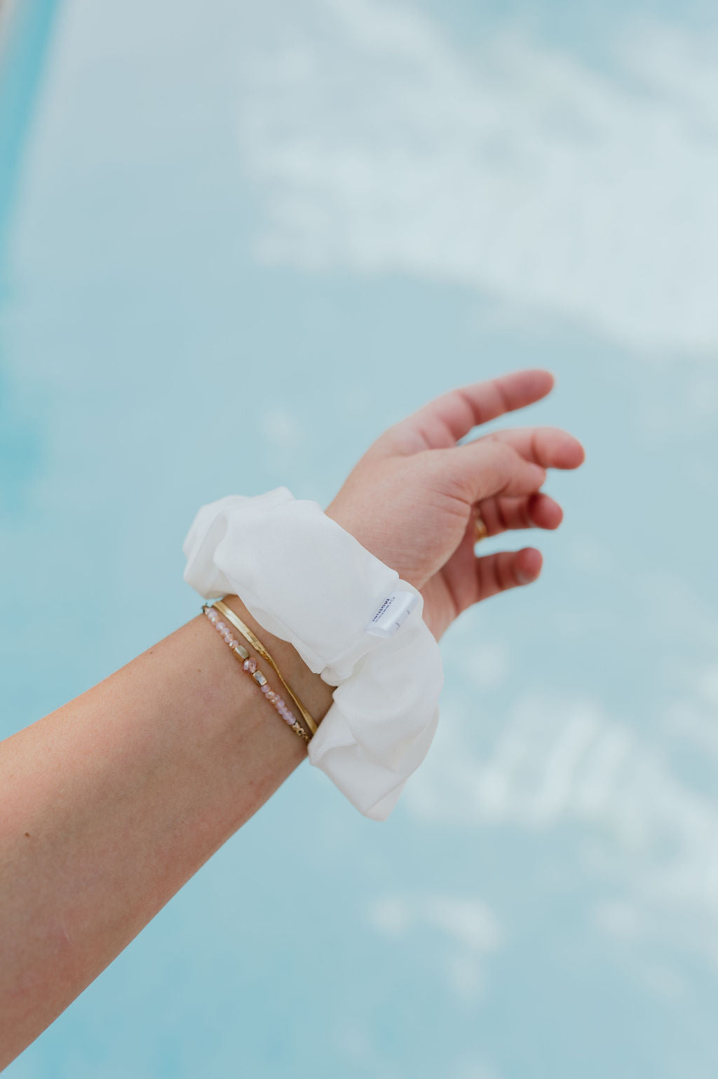 Classic white scrunchie drying fast after water exposure