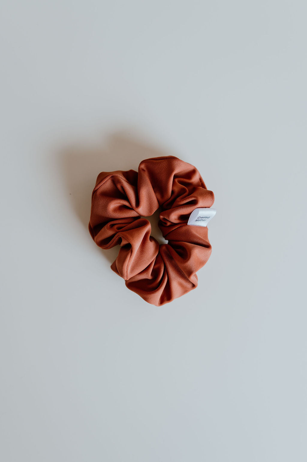 Burnt orange SWIM Scrunchie in size mini