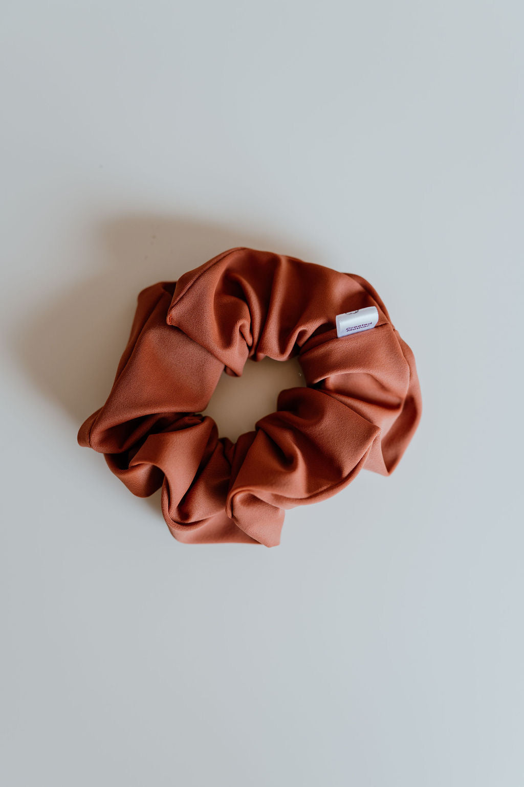 Deep orange scrunchie for a neutral look