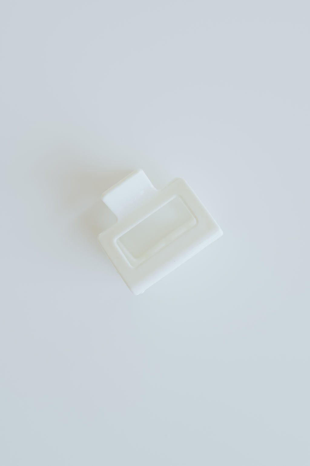 Minimalist square hair claw clip that holds hair securely in place while adding a sleek touch