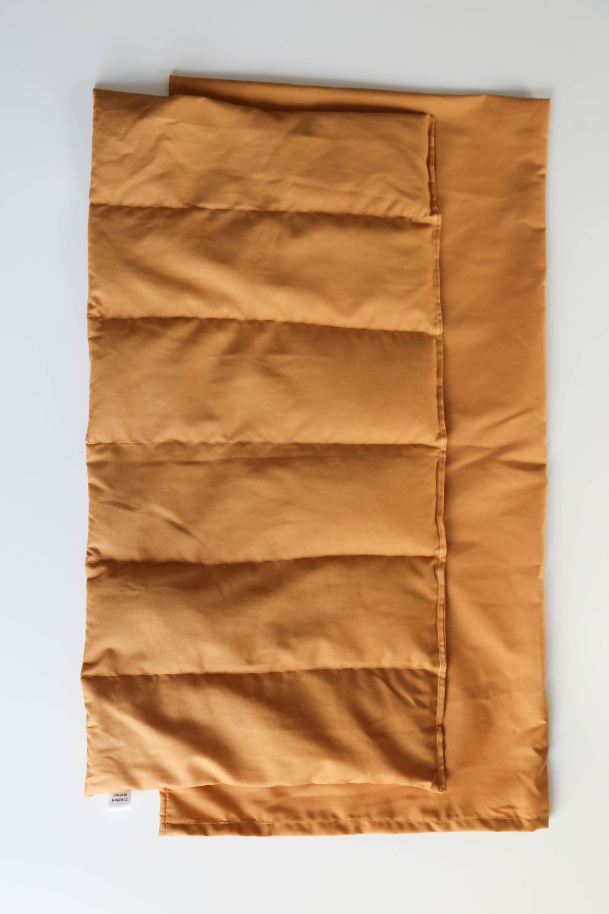 Mustard-colored extra large therapy pack, perfect for applying warm or cold therapy on the back, shoulders, or legs.