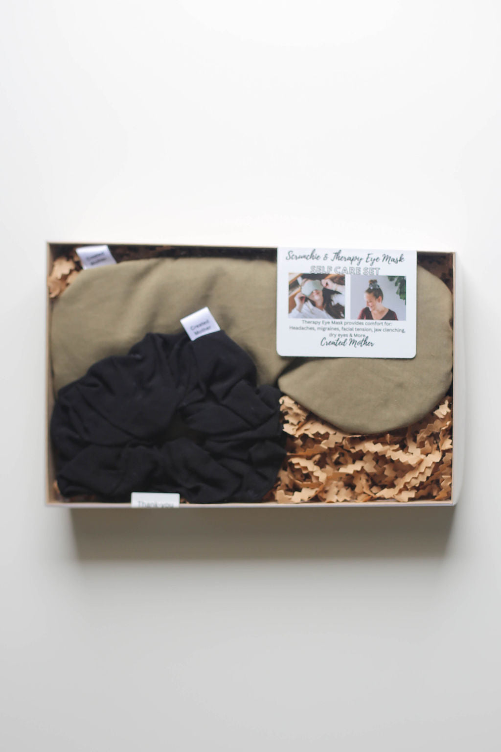 Close-up of cotton blend eye mask for migraine and stress relief, paired with a no-damage scrunchie.