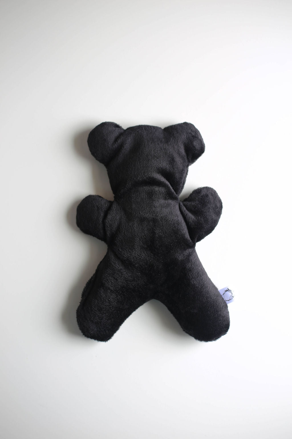 Black therapy bear on a white background