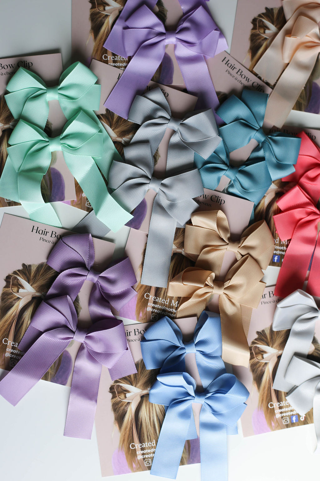 Close-up of premium ribbon texture and secure metal clip on oversized bow accessory.