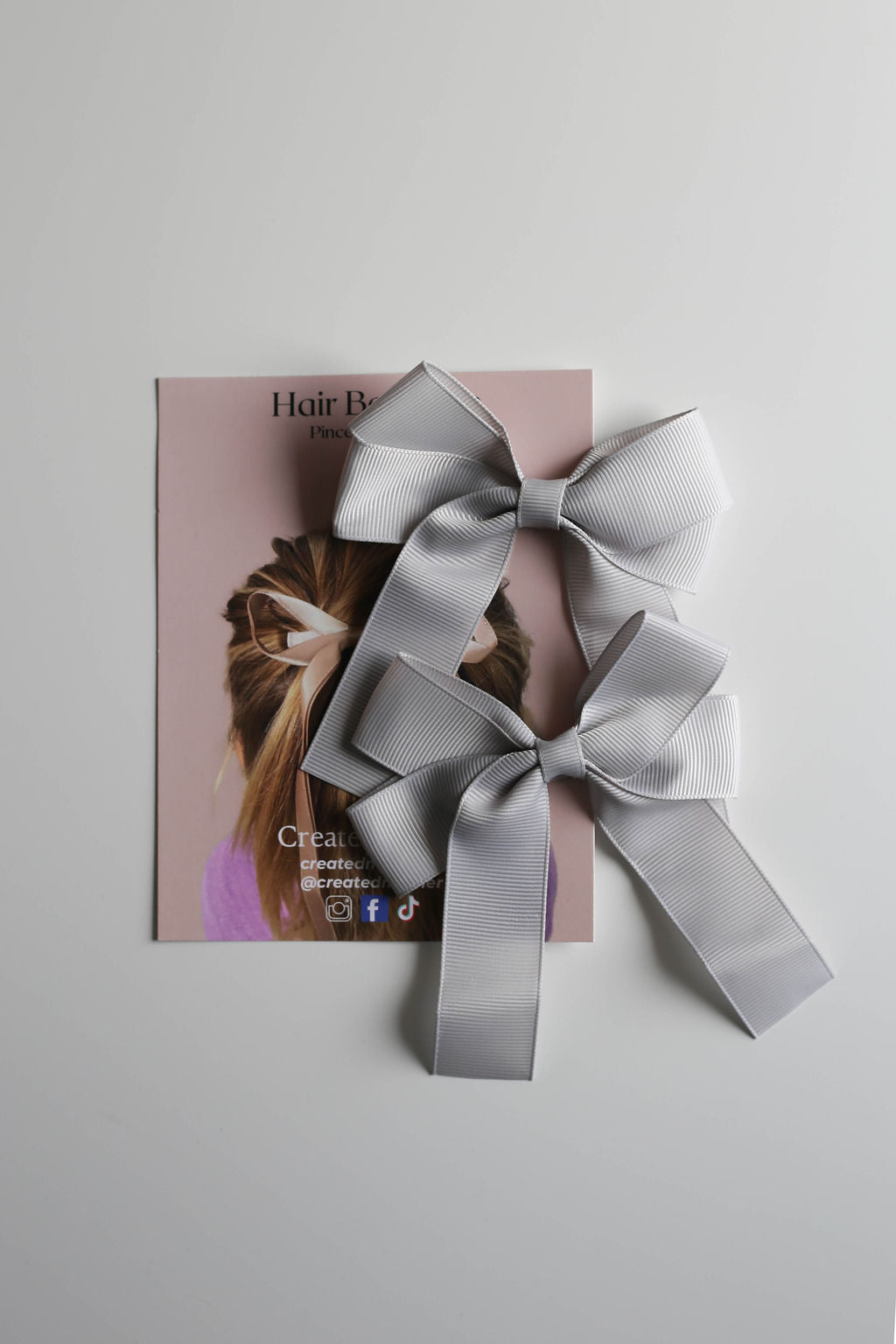 Alligator clip hair bow designed for easy styling on ponytails, braids, or buns.