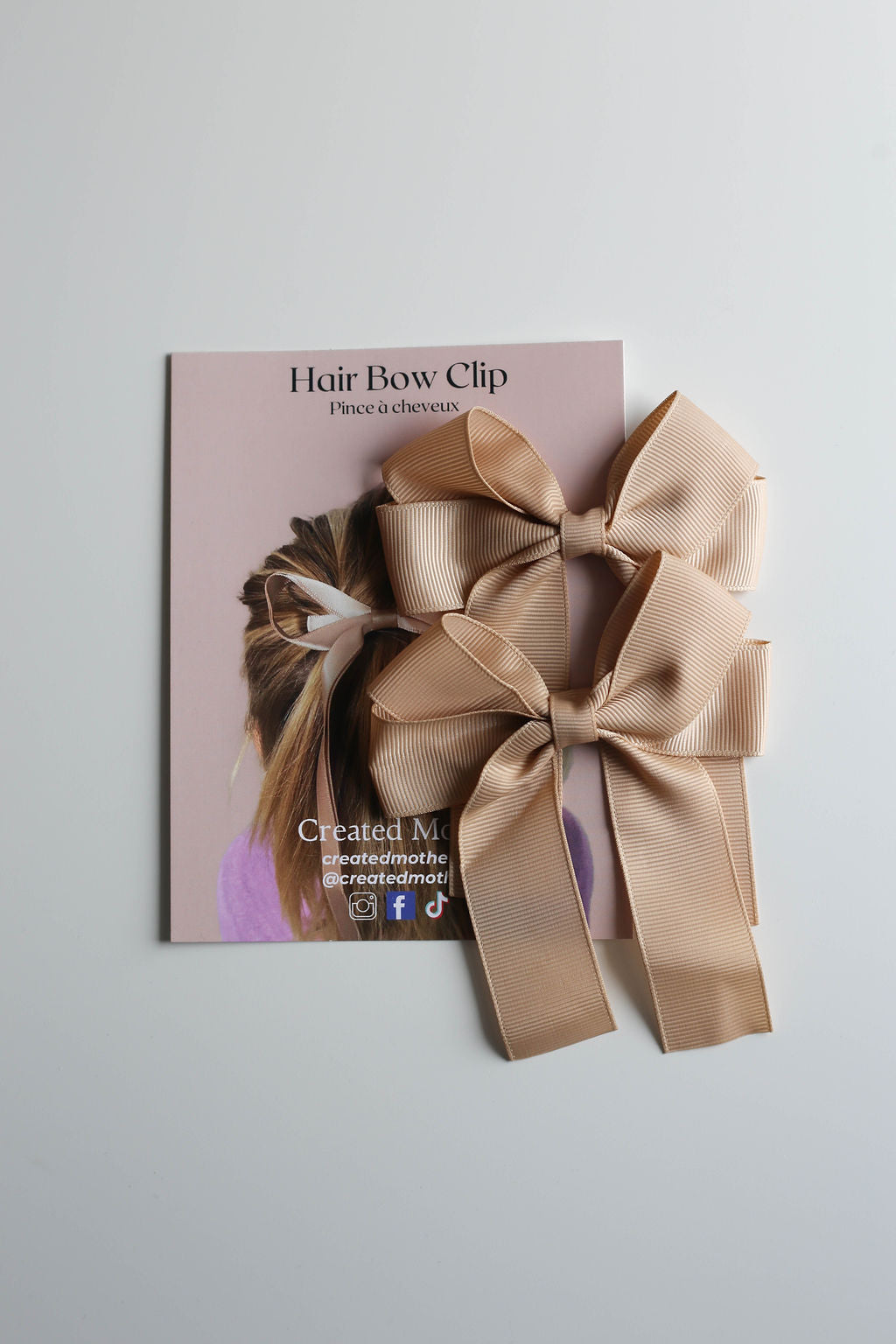 Elegant ribbon hair accessory in neutral taupe, perfect for flower girls or bridesmaids.