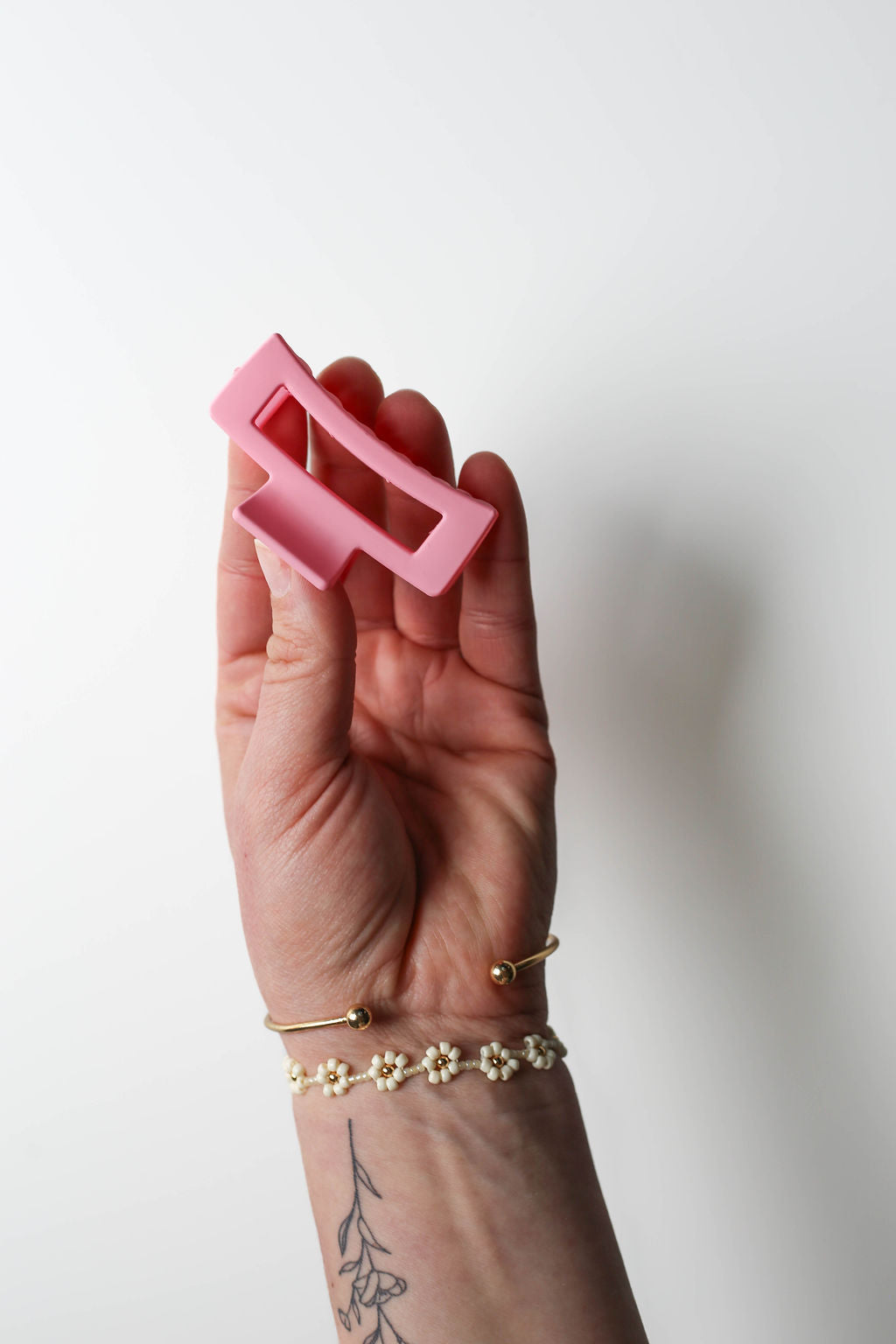 Pastel pink small claw clip in a trendy, functional design.