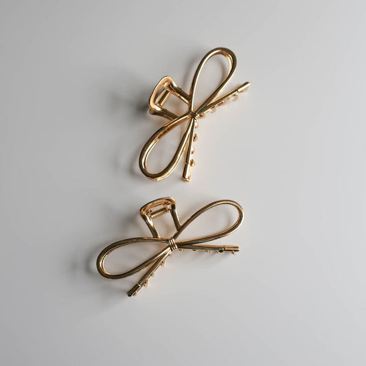 Medium metal bow hair claw clip for thick or long hair.