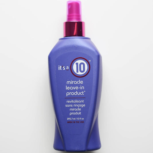 Purple bottle of 'it's a 10' miracle leave-in product with pink spray nozzle on a white background
