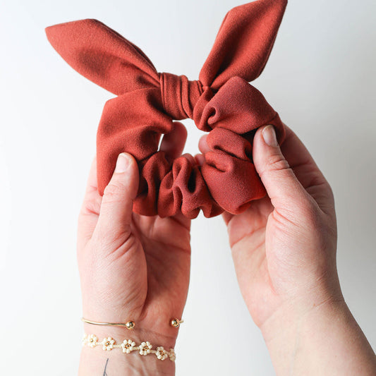 Warm-toned handmade scrunchie in natural light